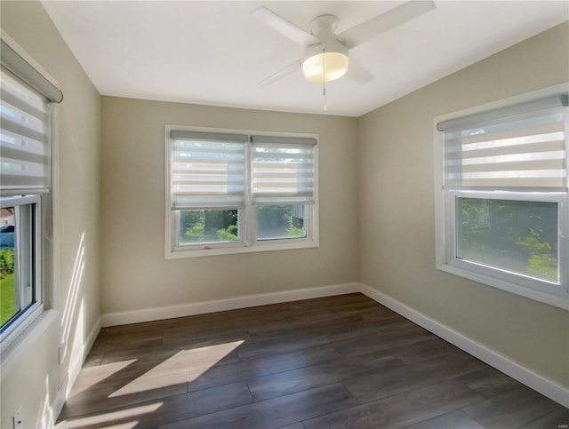 unfurnished room featuring ceiling fan and dark hardwood / wood-style flooring