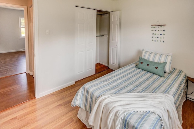 bedroom featuring a closet and light hardwood / wood-style flooring