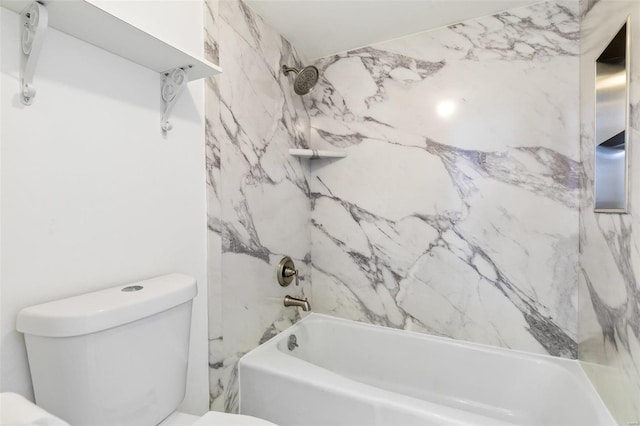 bathroom with toilet and tiled shower / bath combo