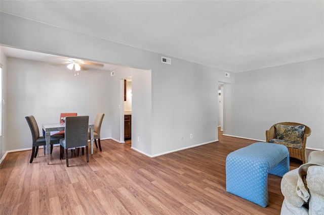 dining area featuring ceiling fan and hardwood / wood-style floors