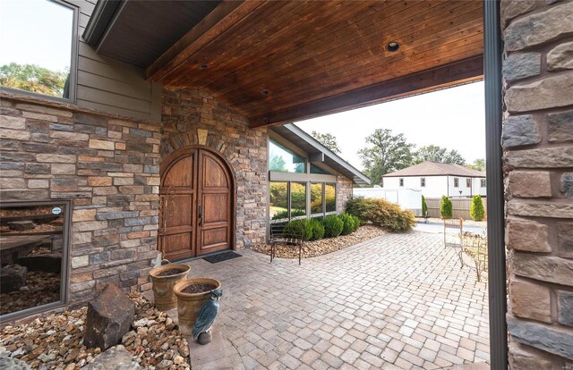 entrance to property with a patio area