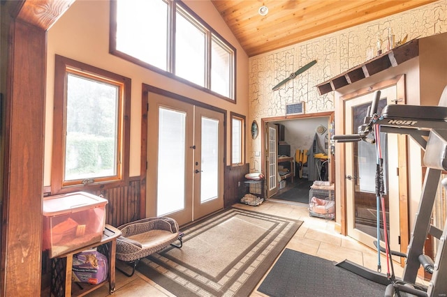 entrance foyer with a wealth of natural light, french doors, high vaulted ceiling, and wooden ceiling