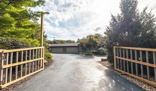 exterior space featuring a garage and an outdoor structure