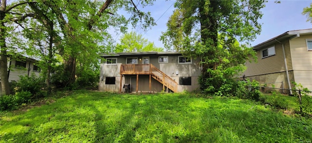 back of property featuring a yard