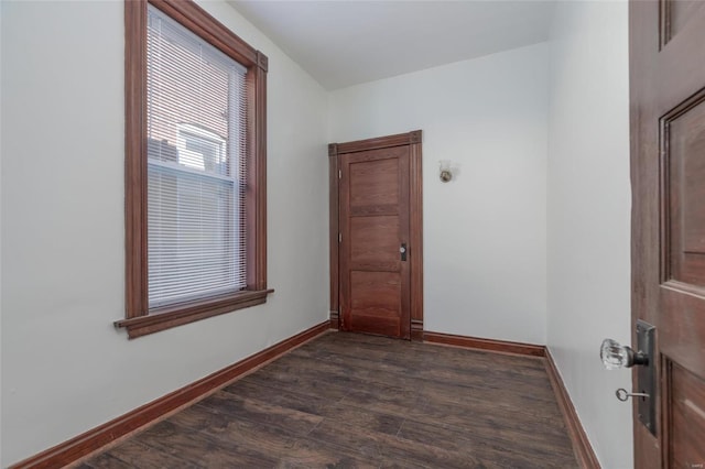 spare room featuring dark hardwood / wood-style floors