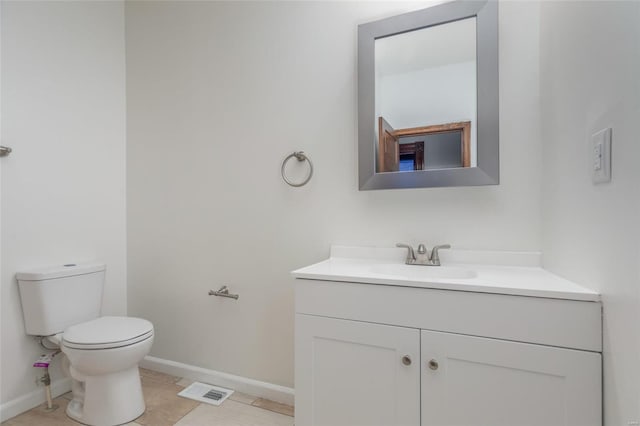 bathroom featuring vanity, toilet, and tile patterned floors