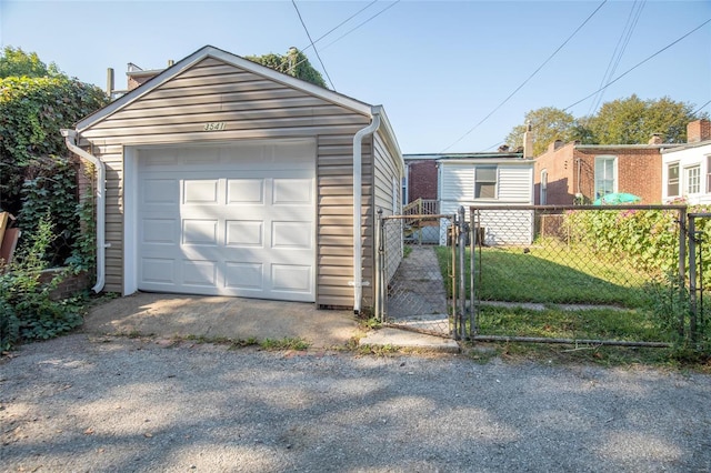 garage featuring a lawn