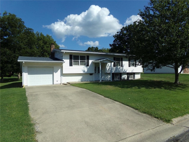 bi-level home with a front lawn and a garage