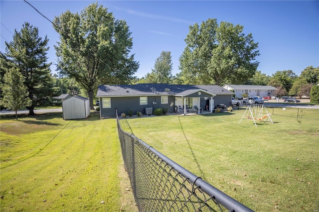 view of yard featuring a shed, a patio, and central AC