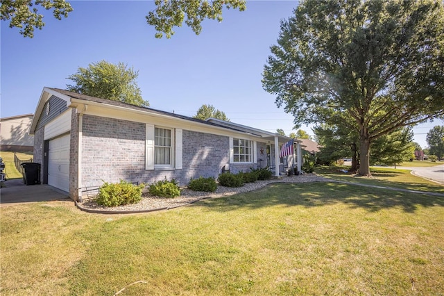 view of front of property featuring a garage and a front yard