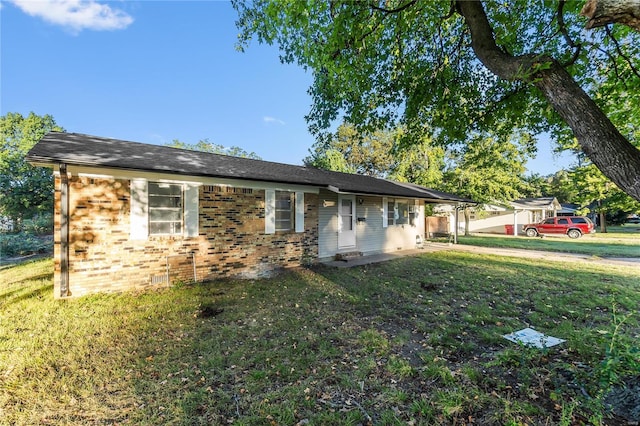 ranch-style home featuring a front yard