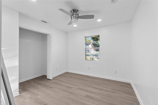 unfurnished room featuring light hardwood / wood-style floors and ceiling fan