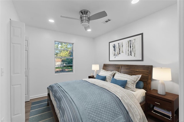 bedroom featuring dark wood-type flooring and ceiling fan