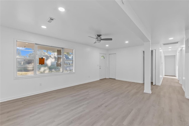 unfurnished living room with light wood-type flooring and ceiling fan