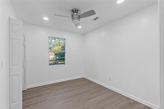 empty room with wood-type flooring and ceiling fan