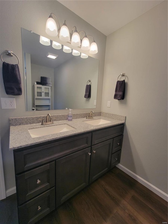 bathroom with vanity and hardwood / wood-style floors