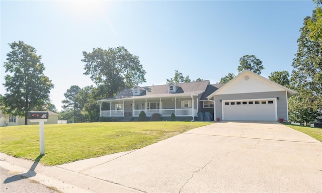 view of front of house featuring a porch, a garage, and a front lawn