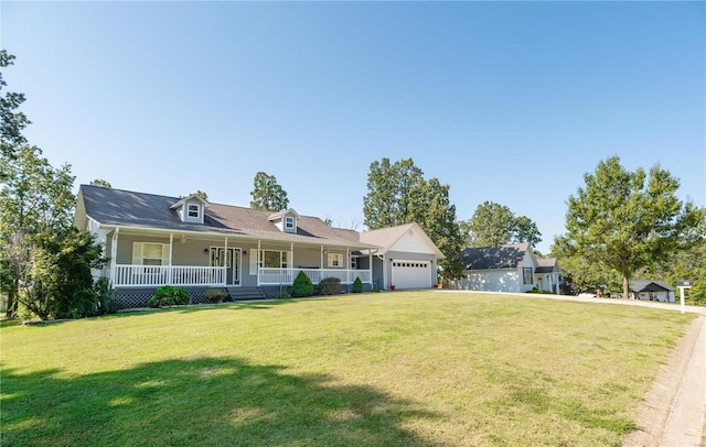 view of front of house with a porch, a garage, and a front yard