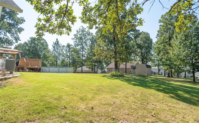 view of yard featuring a wooden deck and a gazebo