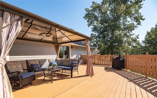 deck featuring an outdoor living space and a gazebo