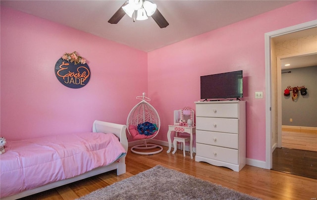 bedroom featuring ceiling fan and hardwood / wood-style flooring