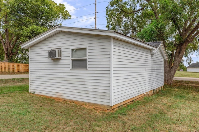 view of outdoor structure featuring a lawn