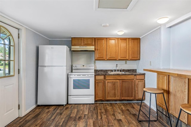 kitchen with dark hardwood / wood-style floors, crown molding, white appliances, and sink