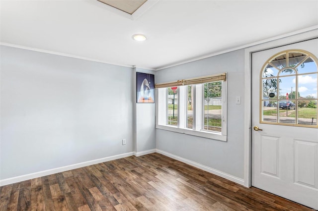 entryway featuring ornamental molding and dark hardwood / wood-style floors