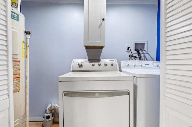 laundry room with cabinets and independent washer and dryer