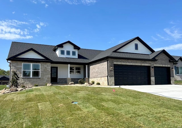 view of front of house featuring a front yard and a garage