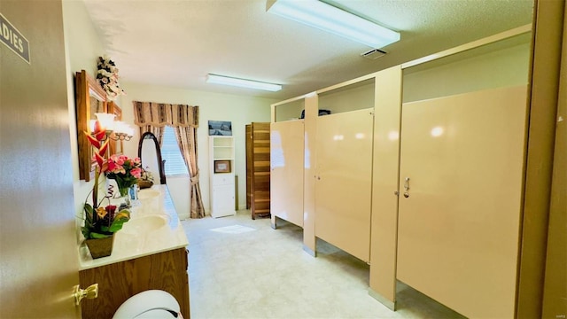 bathroom featuring vanity and a textured ceiling