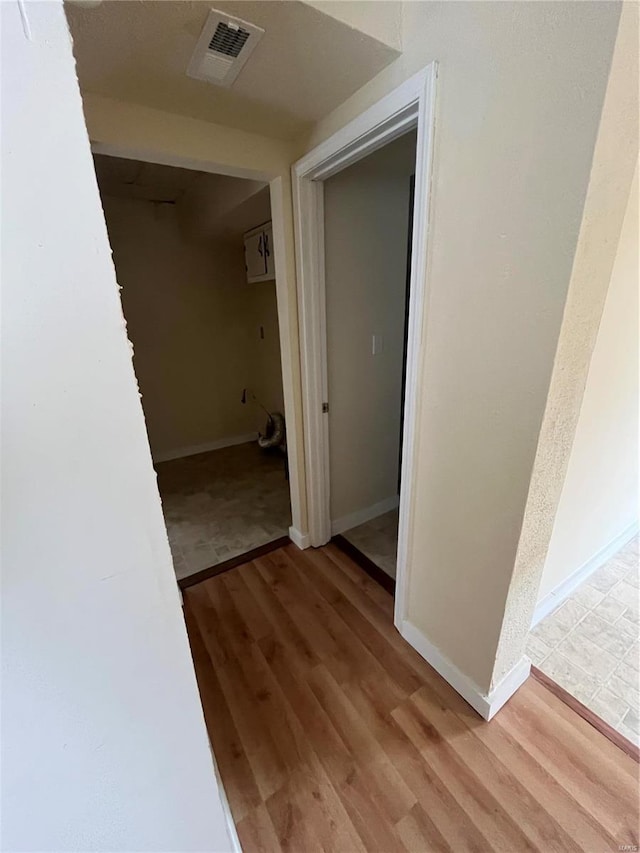 hallway featuring light hardwood / wood-style flooring