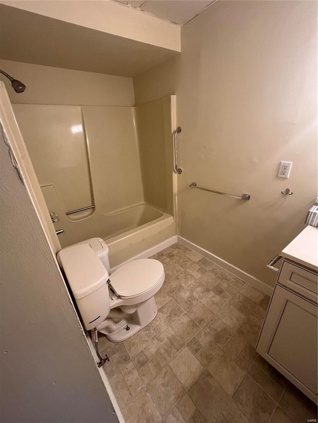 full bathroom featuring vanity, toilet, and washtub / shower combination