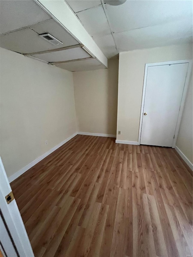 spare room featuring hardwood / wood-style floors