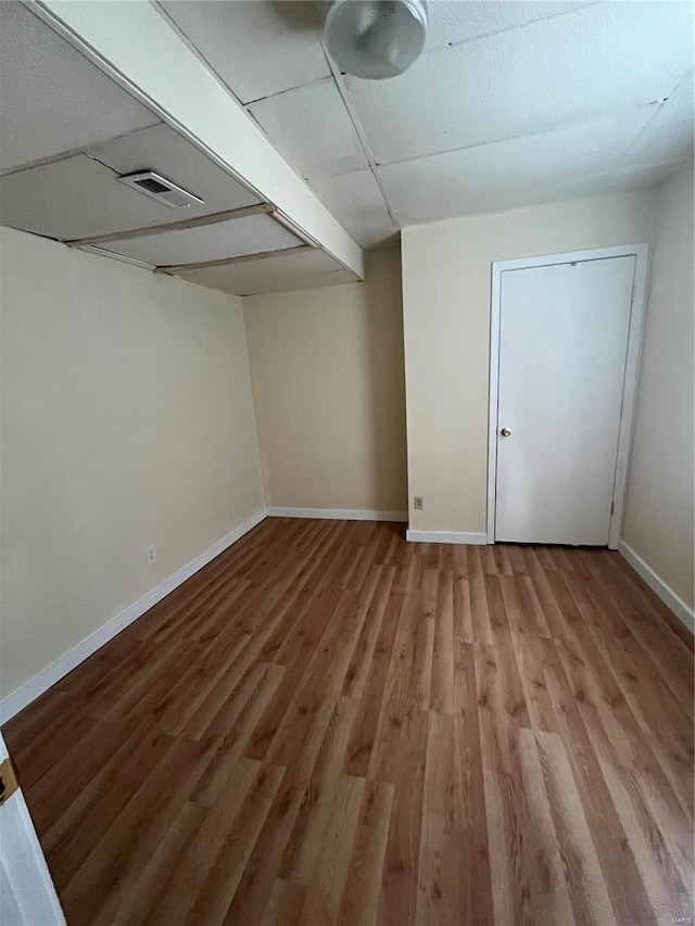 empty room featuring wood-type flooring