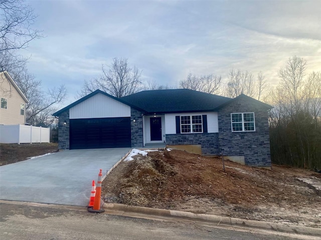 single story home featuring a garage, driveway, stone siding, and fence