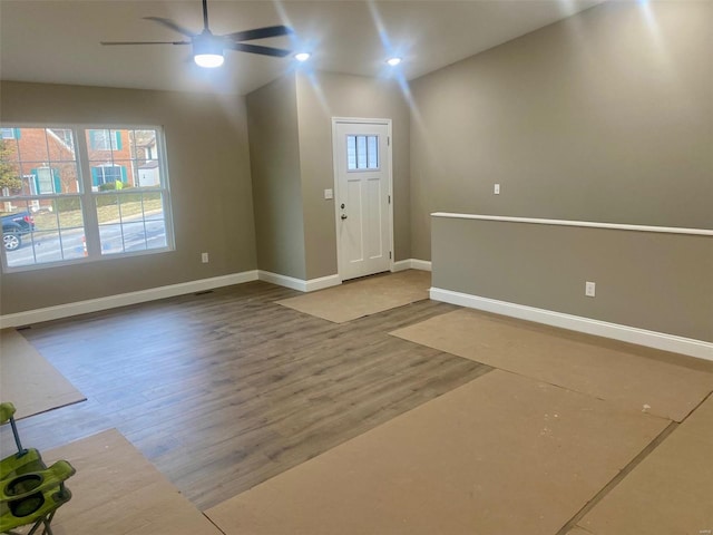 entrance foyer with ceiling fan, wood finished floors, and baseboards