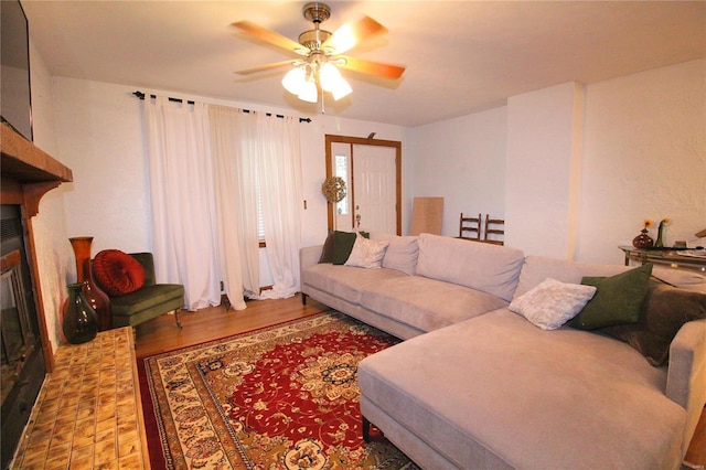 living room with ceiling fan and wood-type flooring