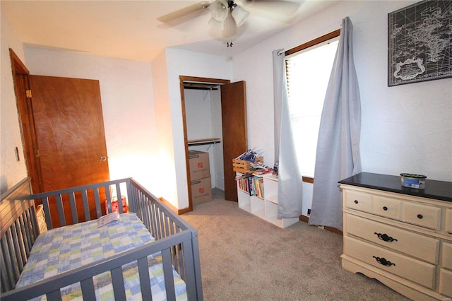 bedroom with light colored carpet and ceiling fan