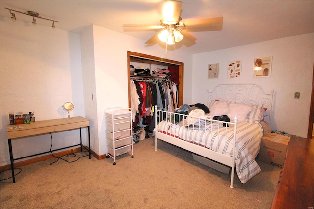 bedroom featuring ceiling fan, a closet, and carpet floors