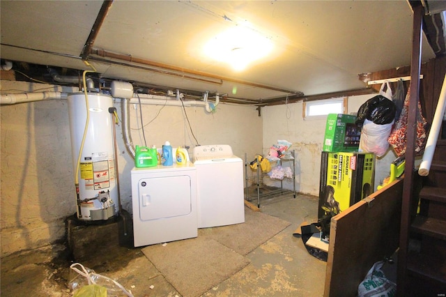 laundry room featuring gas water heater and washer and dryer