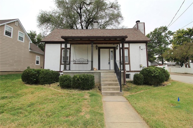 view of front of home featuring a porch and a front lawn