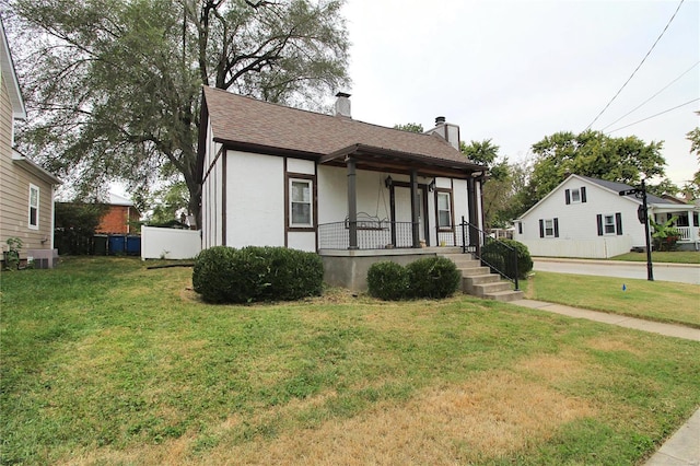 view of front of home featuring a front yard and a porch