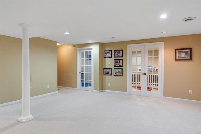 interior space featuring french doors and ornate columns