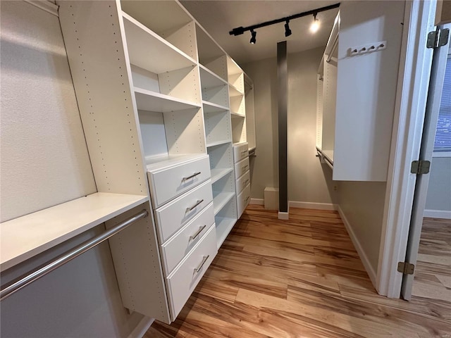 walk in closet featuring light wood-type flooring