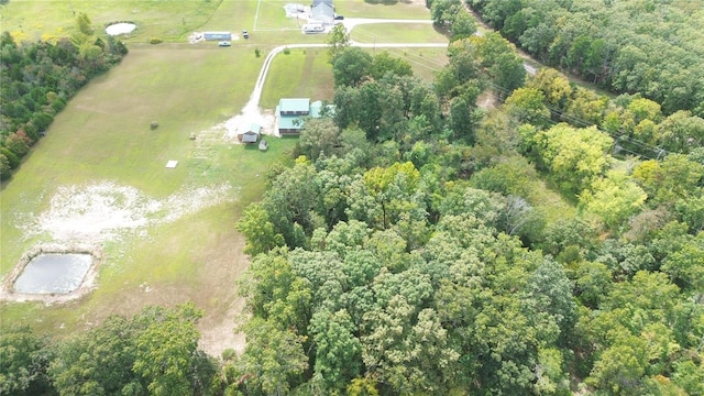 birds eye view of property with a rural view