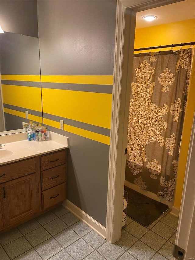 bathroom with vanity and curtained shower