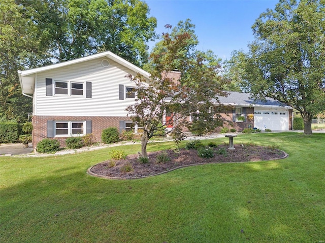 view of front of home featuring a garage and a front lawn