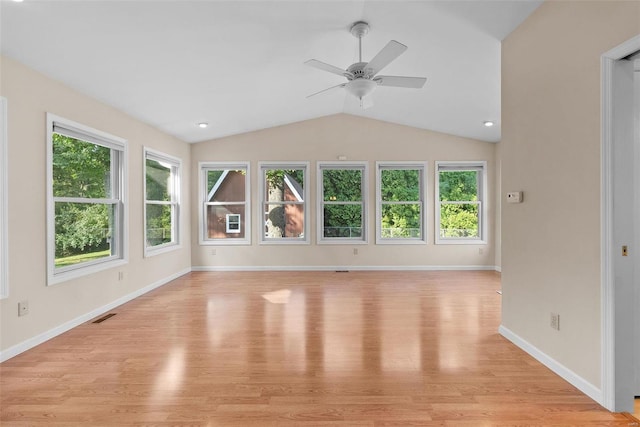 unfurnished living room featuring ceiling fan, light wood-type flooring, and vaulted ceiling