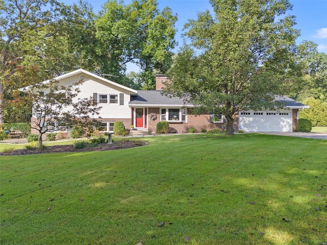 tri-level home featuring a garage and a front yard